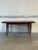 This rectangular coffee table features an extendable design with two pull-out leaves. Its clean lines and tapered legs...