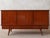 This sideboard is a rare 1960s design by French designer Gaston Poisson. Crafted in teak, it bears the master's signature:...