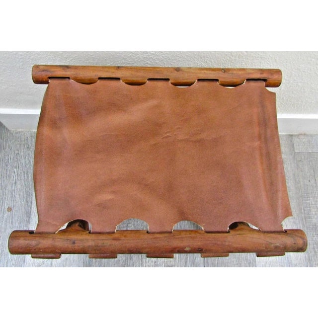 Vintage Danish Modern "Guldhøj" (Gold Hill) Teak and Cognac Saddle Leather Folding Stool by Poul Hundevad Designer: Poul...