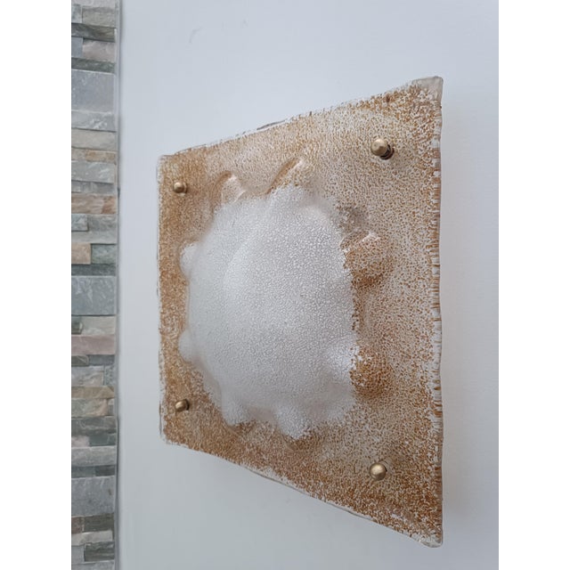Beautiful Wall Sconce by Mazzega. Italy, 1970s. White lacquered metal frame. It supports a magnificent frosted Murano...
