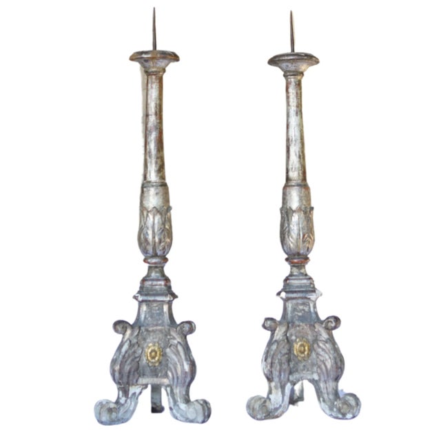 A rare surviving pair of Italian altar prickets from the 18th century, carved from wood and originally silvered and gilded...