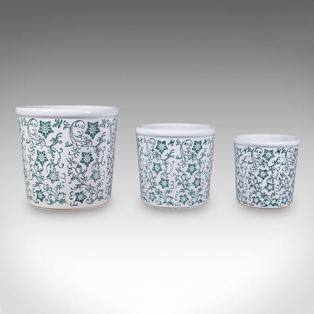 This is a set of three vintage tree planters. A Portuguese, ceramic jardiniere with green & white pattern, dating to the...