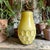 This piece features a distinctive yellow crackle glaze body, a contrasting dark unglazed clay rim, and a raised,...