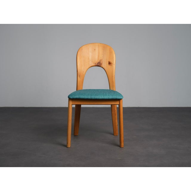 A refined set of six dining chairs produced by koefoed danmark in denmark during the 1990s. The design combines solid...