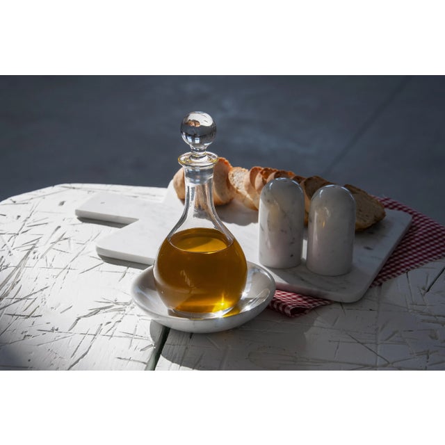 Set composed of one chopping board (33x21x1cm), one little dish (13x3cm) and the salt & pepper shakers (4x8cm) in white...