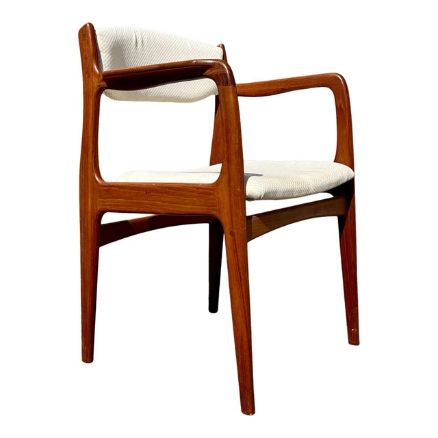 Incredible set of eight vintage Scandinavian modern teak dining chairs. This set includes six side, and two arm chairs....