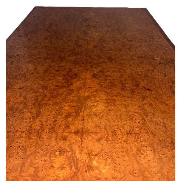 Striking late 1970s burlwood Parsons extension dining table featuring dramatic book-matched burl veneer and clean...