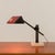 This mid-century desk lamp is from the 1970s and closely resembles Jean Prouvé's designs as well as Memphis Milano...