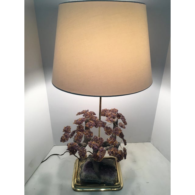 Stunning crystal table lamp made from the amethyst rock crystal. A one of a kind lamp! It is in excellent condition. The...