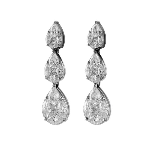 Sensational illusion set natural diamond earrings with the look of pear diamonds. High jewelry by Alexander Beverly Hills....