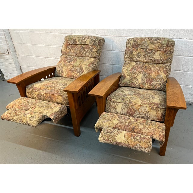 A comfortable and character-rich pair of Mission style reclining lounge chairs, complete with integrated ottoman...