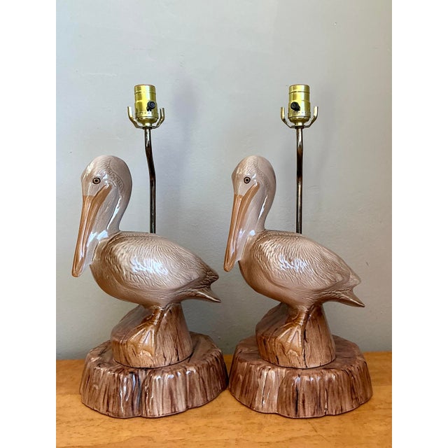 This striking pair of vintage table lamps perfectly captures the whimsical yet sophisticated essence of Coastal Regency...