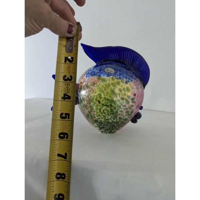 Add a splash of vibrant color and artistic elegance to your home or office decor with this stunning Murano glass fish...