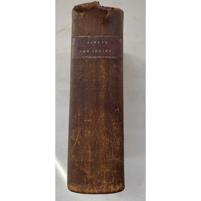 Offering an antique leather bound book. Laws of the State of New Jersey. Printed in 1821 by Joseph Justice, Trenton. This...