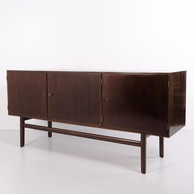 Mahogany sideboard from the rungstedlund series by poul jeppesens møbelfabrik. Classic danish design with a functional and...