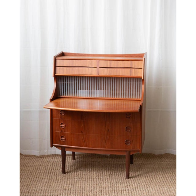An elegant Danish teak secretary chest attributed to Falsig, circa 1960s, exemplifying the refined craftsmanship of mid-...