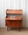 An elegant Danish teak secretary chest attributed to Falsig, circa 1960s, exemplifying the refined craftsmanship of mid-...