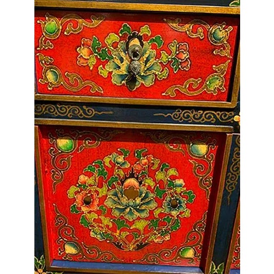This Tibetan hand painted cabinet is made out of elm wood. It has 6 doors and 3 drawers. It is very elegant piece to have...
