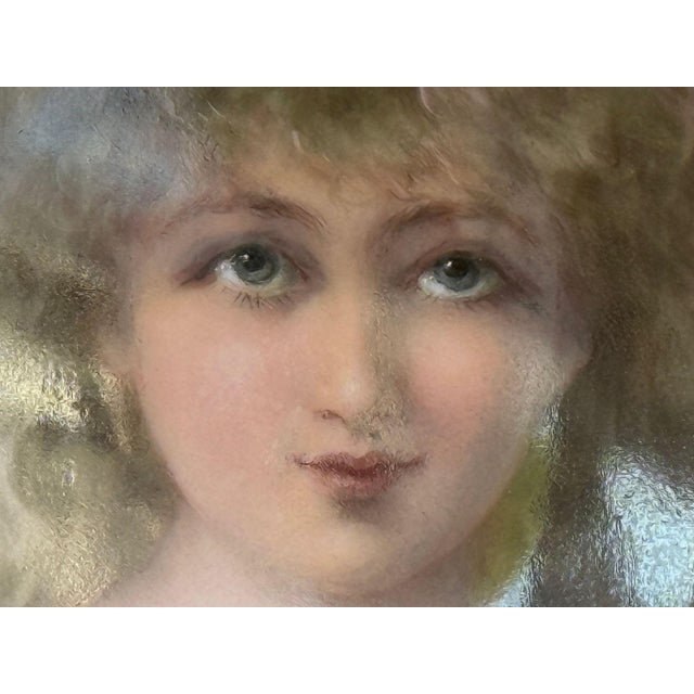 An elegant 19th century Austrian Vienna porcelain portrait plate, finely hand-painted with the bust-length portrait of a...