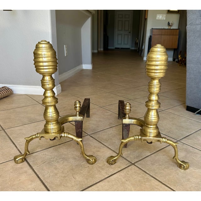 Pair of large antique brass Federal style brass andirons with ball and claw feet and beehive motif. Made of solid heavy...