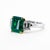 Platinum and 18k ring with top gem 3.88 carat Colombian Muzo emerald and two cloroless sheild cut diamonds weighing 1.02...