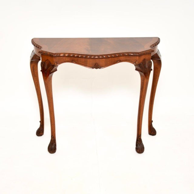 A lovely antique console side table in the Queen Anne style. This was made in England, it dates from around the 1930’s. It...
