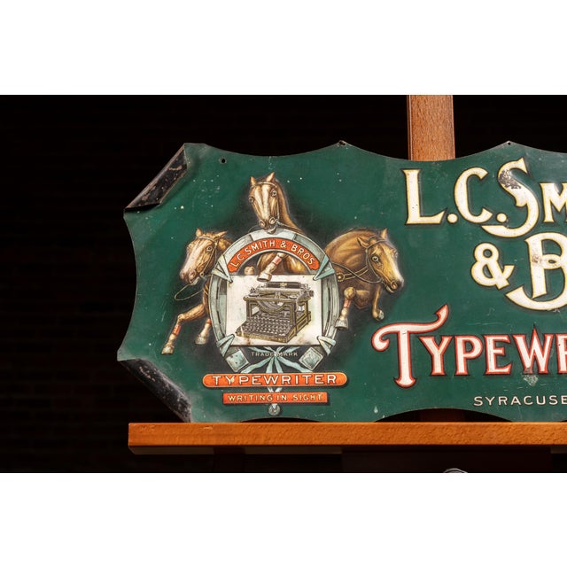 c. 1900s-1910s; L.C. Smith & Bros. Typewriter Co. - Syracuse, NY Colorful self-framed tin lithograph advertising sign for...