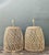 Infuse your living space with the warm, organic textures of this exceptional pair of vintage woven rattan table lamps....