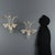 A pair of Venetian blown glass wall sconces, characterized by a transparency enhanced by delicate golden hues. The two...