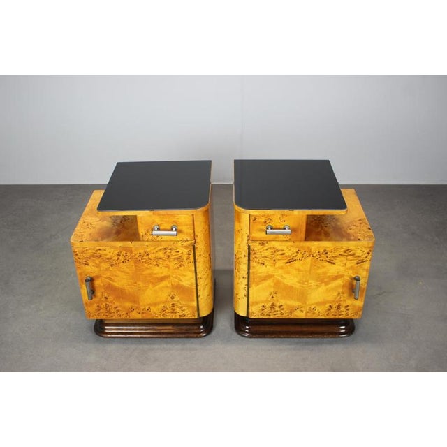 A refined pair of bedside tables designed by Jindřich Halabala, produced in Czechoslovakia during the 1950s. These...