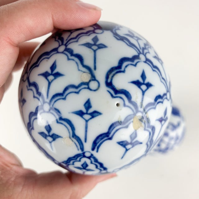Fantastic set of two vintage porcelain blue and white patterned carpet balls. Love the organic and floral patterns. Great...