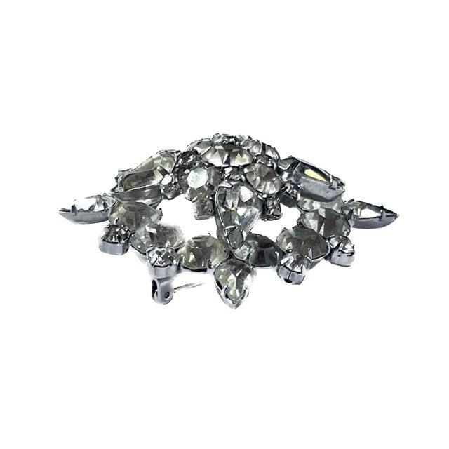 Vintage starburst rhinestone brooch pin with pin clasp on the reverse side. No maker's marks