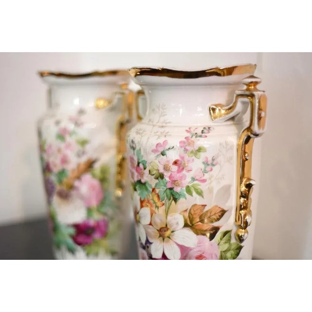 Pair of large old Paris white ceramic truncated vessels with front decorated with colorful flowers. Small upper edge, base...