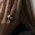 This bold vintage Maz ring pairs striking onyx with sparkling diamonds in rich 18k yellow gold, reflecting the sculptural...