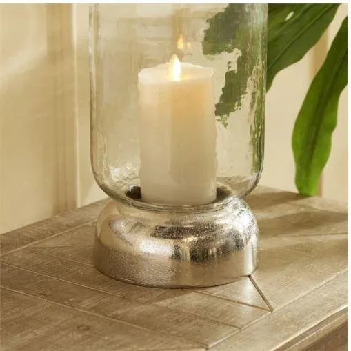 With a cool chrome finish and a domed base, this hurricane is a fresh accent for dining table, console or bookshelf. The...