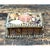 This keepsake box celebrates coastal folk-art tradition through its densely arranged shell-encrusted lid, where an...