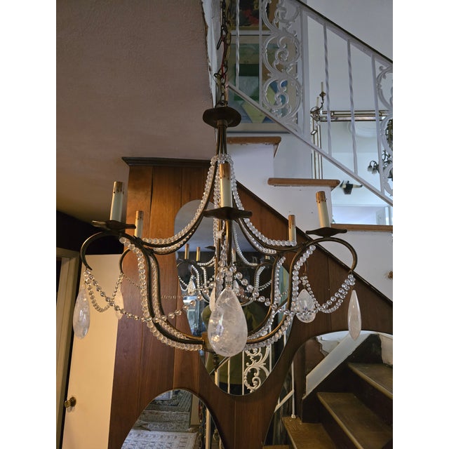 A very decorative French Bagues style chandelier with rock crystal applications. All hand assembled with rich rock crystal...