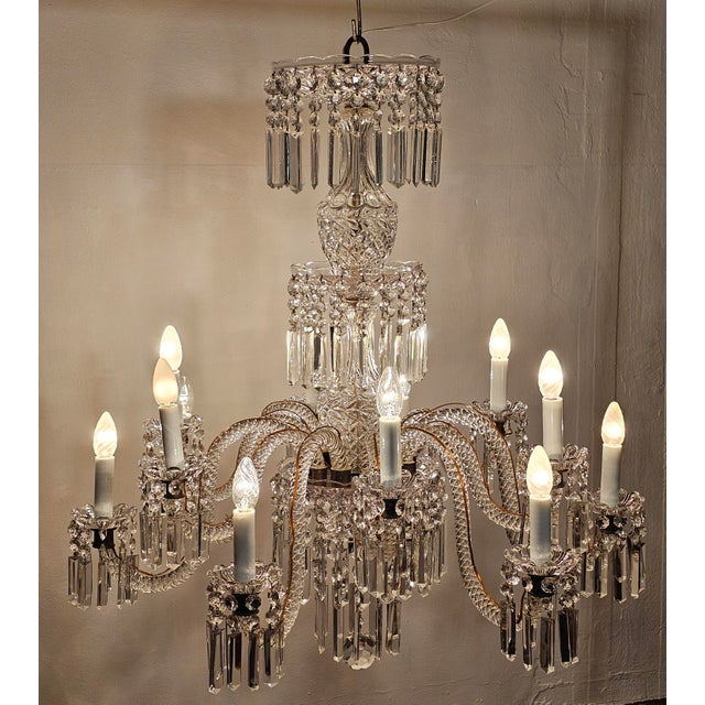Splendid and refined 12-light chandelier made of Bohemian crystal in the 1930s. Exceptional craftsmanship of the period....