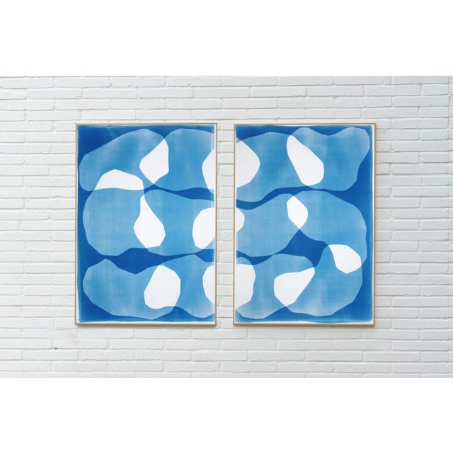 Zigzag Ovals is a cyanotype monotype diptych that explores the interplay between fluid forms and structured repetition....