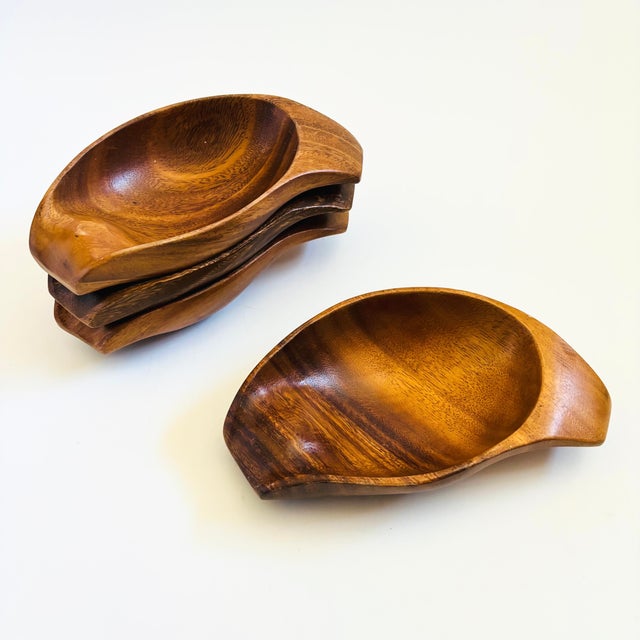 A set of 4 vintage wood bowls. Carved smooth into unique curved shapes. Beautiful natural grain to each piece. Perfect for...