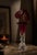 A stunning example of American hand – blown art glass featuring a bold cranberry, ruby trumpet flare a top a sculptural...