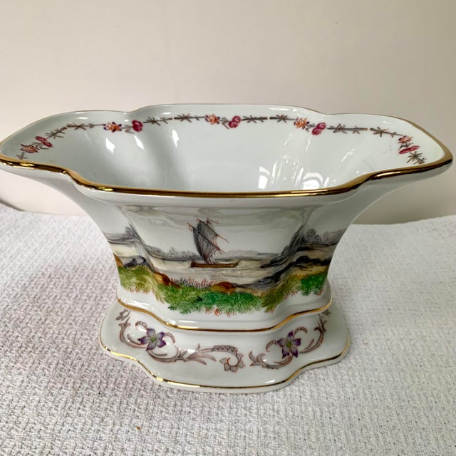 Elegant Dresden hand-painted porcelain jardinière or centerpiece bowl featuring exotic Asian inspired scenes framed by...