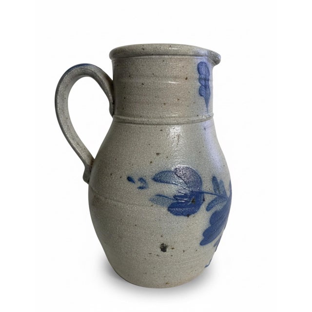 A substantial vintage stoneware pitcher by Rowe Pottery Works of Cambridge, Wisconsin, known for its American-made salt-...