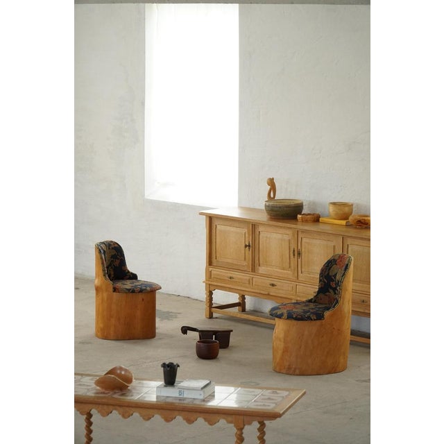 A rare Scandinavian stump chair, known as a "Kubstol", crafted from a solid section of pine trunk and produced in Sweden...