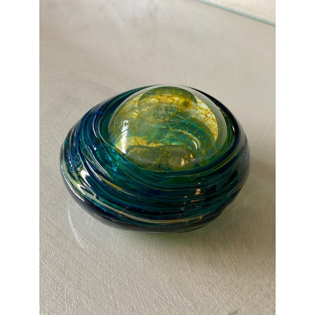 An elegant signed artistic glass object, crafted by the renowned Mdina Glass, a manufacturer synonymous with Mediterranean...