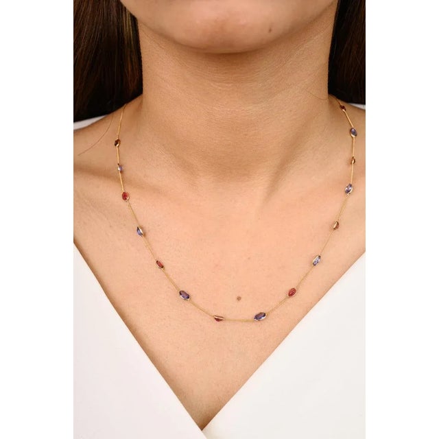 This is part of Chairish’s Fine Jewelry assortment. Unique Tanzanite and Tourmaline Station Necklace in 18K Gold studded...