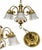 An elegant vintage chandelier featuring a polished brass frame with graceful curved arms and decorative white porcelain...