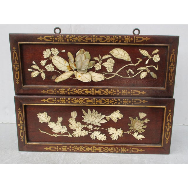 Matching mahogany and mother-of-pearl planter boxes. Late 19th-century Japanese inlaid floral patterns over each face....