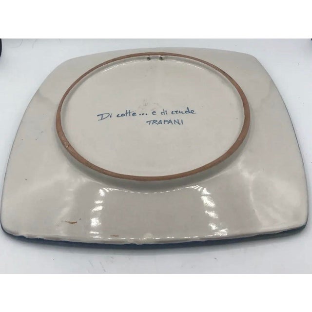 Hand-painted Sicilian ceramic platter depicting the iconic windmills and salt flats of Trapani, on the western coast of...