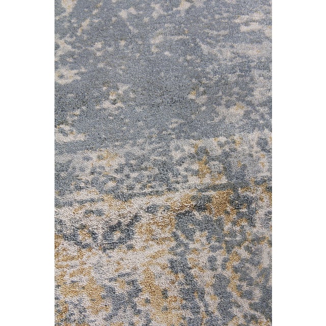 Unique splashes of color guide the eye through the Newport rug's spontaneous design. Handmade from the richest New Zealand...